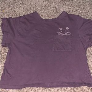 A dim purple space quote cropped shirt.